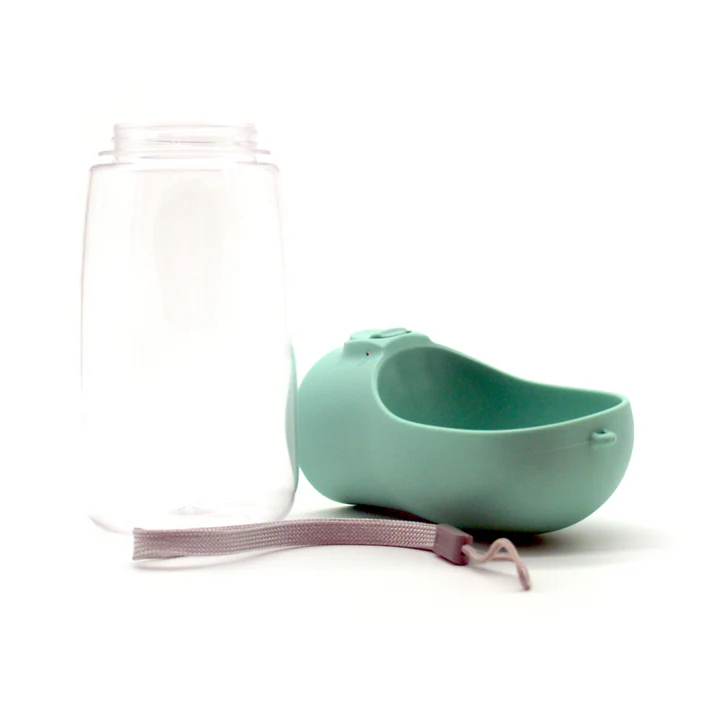 A portable pet water bottle with a transparent container, a detachable mint-green water bowl, and a gray wrist strap—an ideal gift idea for pet lovers, displayed on a white background. alwaysagift.co.uk