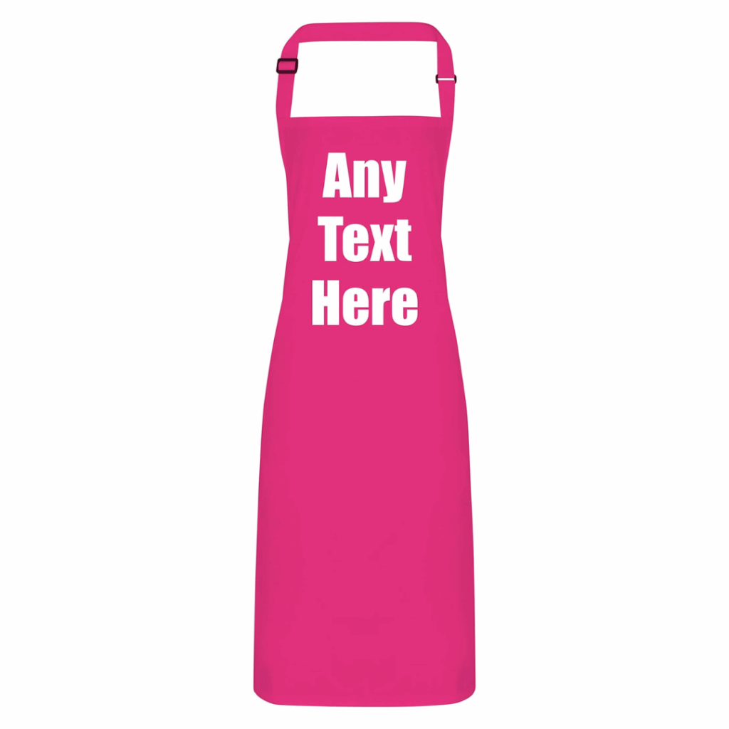A bright pink apron with an adjustable neck strap, featuring the words Any Text Here in bold white letters on the chest area—perfect for baking gifts or creative gift ideas for women who love spending time in the kitchen. gift idea