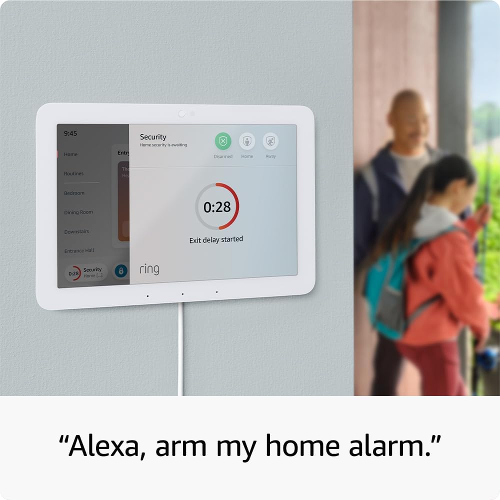 A Ring home security panel on a wall shows a 28-second exit delay countdown. In the background, a man and a girl with a backpack are walking out the door. Text below reads, Alexa, arm my home alarm—seamlessly integrated with Elementor. alwaysagift.co.uk