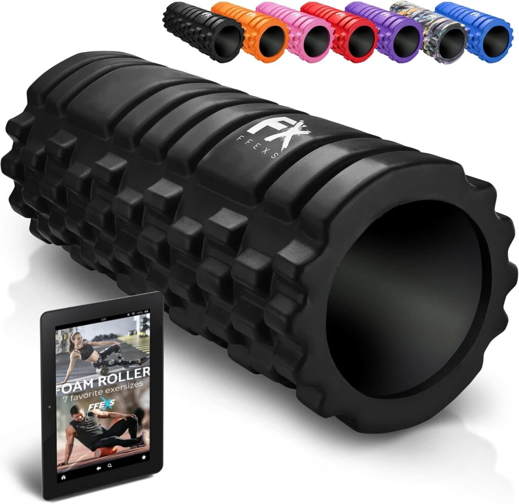 A black textured foam roller is shown in the foreground with six smaller foam rollers in various colors above it. An Elementor-designed digital device screen displays a woman exercising and the words Foam Roller: 7 Favorite Exercises. alwaysagift.co.uk